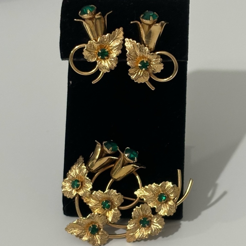 Vintage brooch and earring set with green stones and gold tone metal